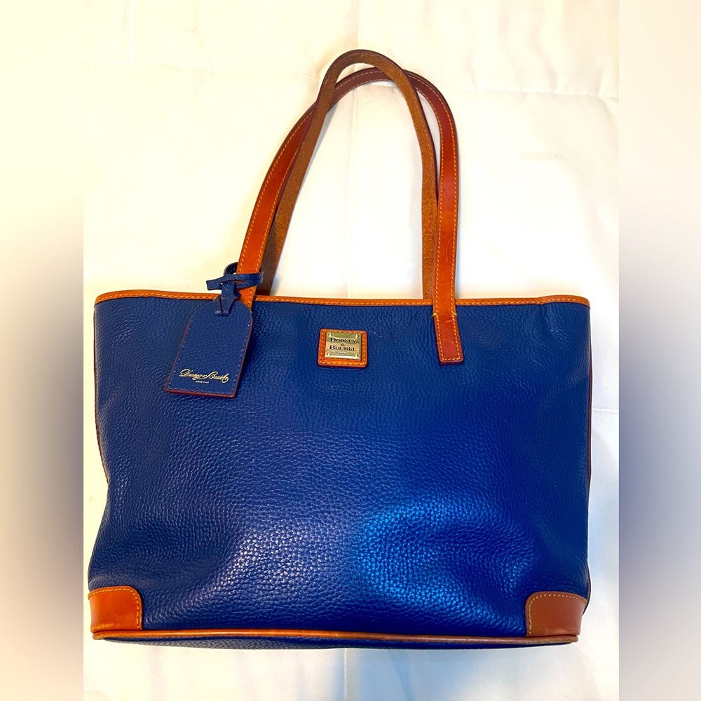 Dooney & Bourke classic blue and tan purse with pink interior